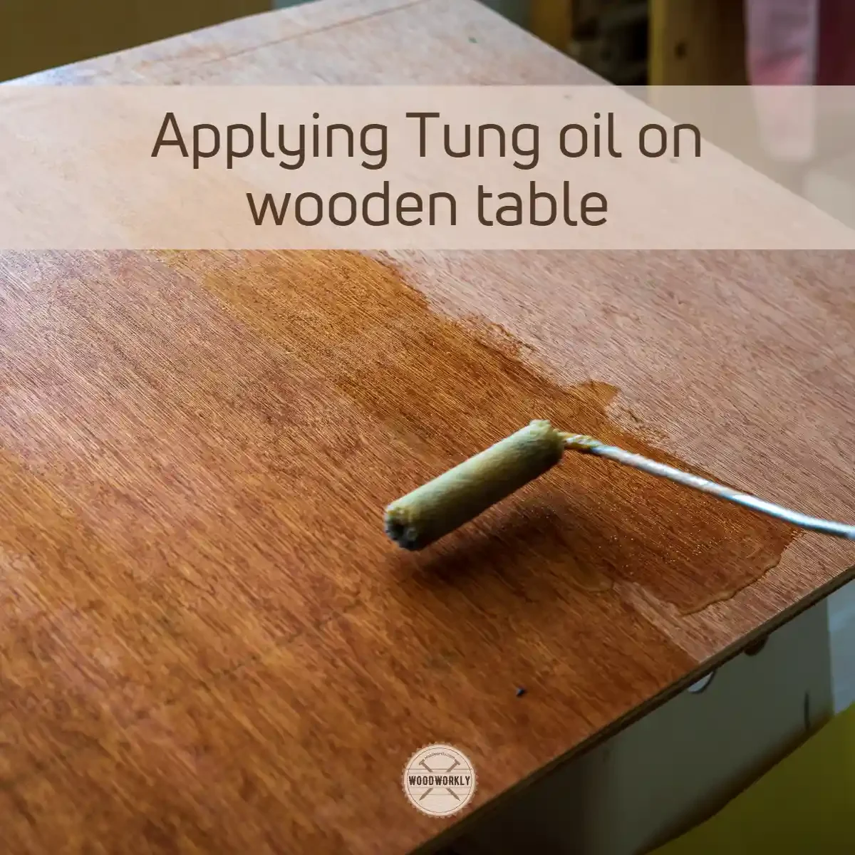 applying tung oil on wooden table